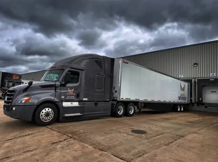 Wise Wheeler truck and dry van at a loading dock